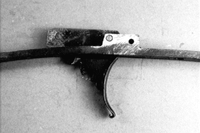 Fig. 14b) The trigger pivot point was moved up and back in the trigger plate bolster to accommodate the sear position of the new lock.